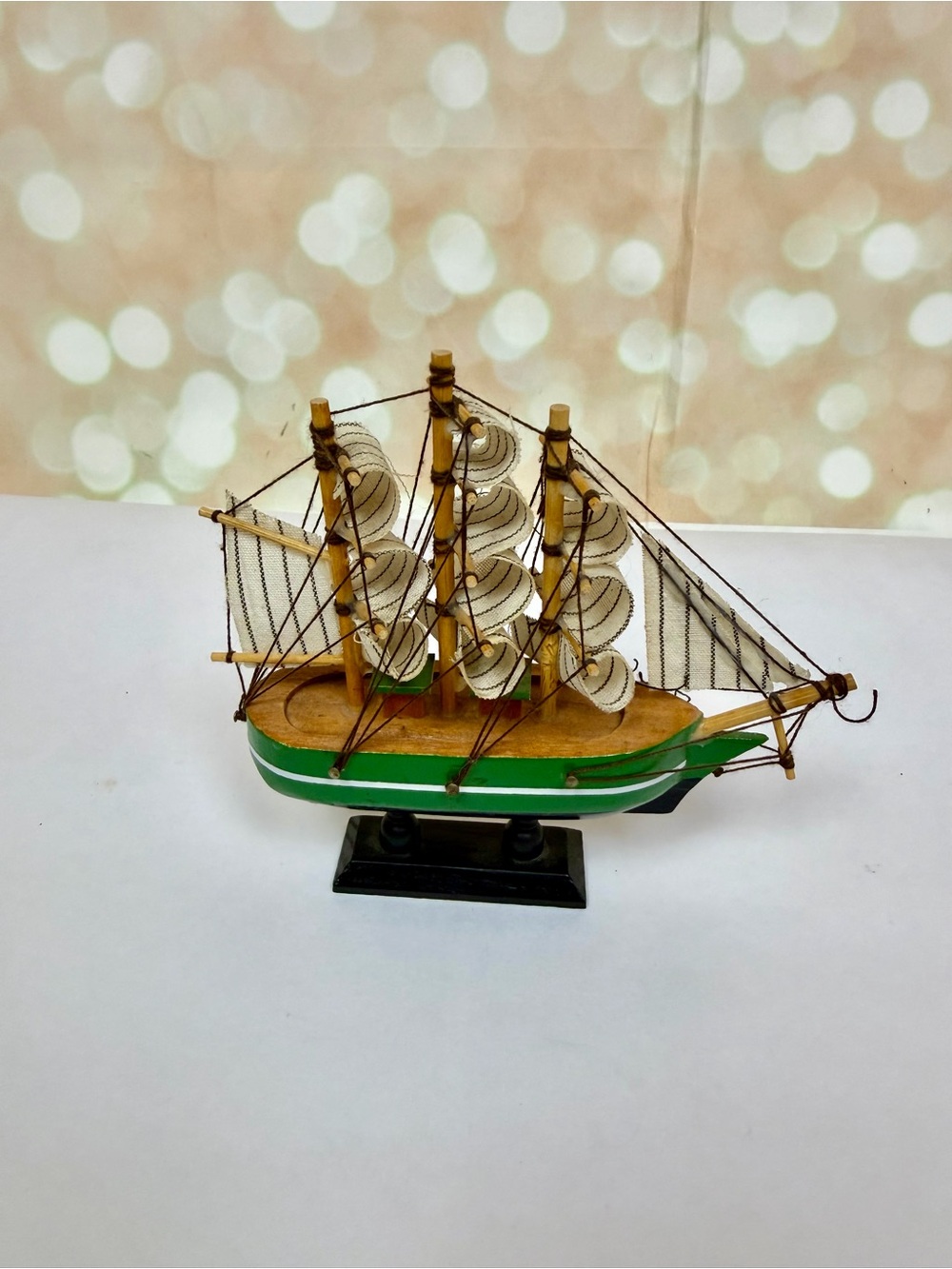 Handcrafted Wooden Sailboat Model in Green and Natural Wood